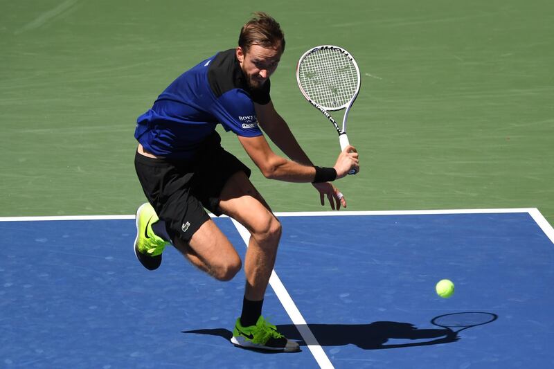 Daniil Medvedev chases down the ball against JJ Wolf during the US Open third round. Reuters