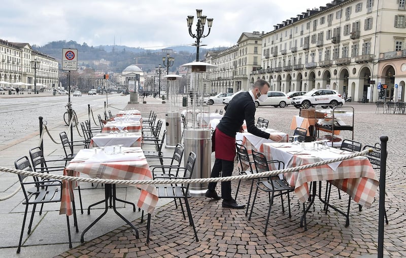 Restaurants prepare to reopen in Turin. EPA