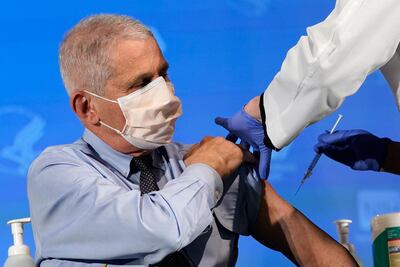 FILE - In this Dec. 22, 2020, file photo Dr. Anthony Fauci, director of the National Institute of Allergy and Infectious Diseases, prepares to receive his first dose of the COVID-19 vaccine at the National Institutes of Health in Bethesda, Md. (AP Photo/Patrick Semansky, Pool, File)