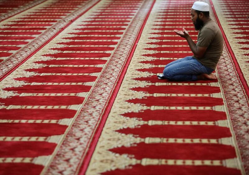 A Muslim boy prays during the holy month of Ramadan at a mosque in Colombo, Sri Lanka. Dinuka Liyanawatte / Reuters