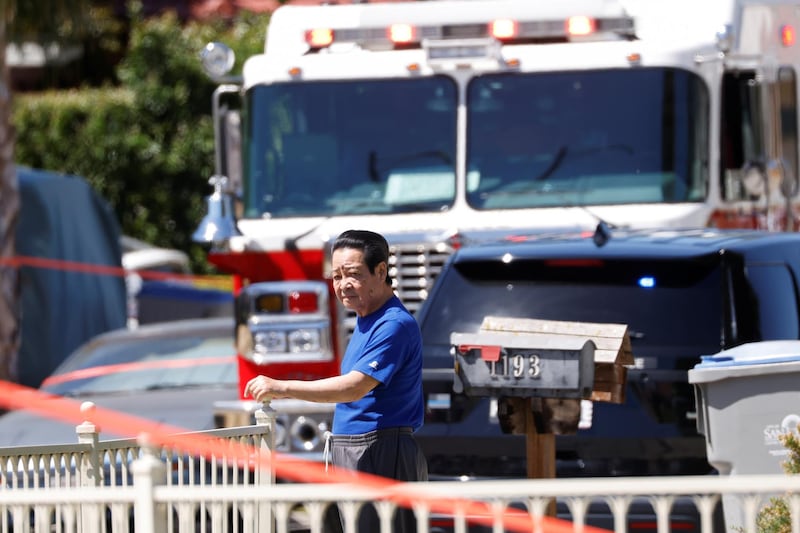 Emergency services arrive after a fire at the house of the suspected gunman. Reuters