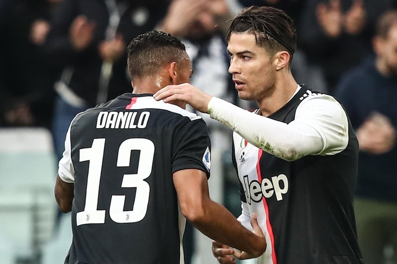 Juventus forward Cristiano Ronaldo (R) celebrates with Danilo after scoring during the Italian Serie A match against Udinese at the Allianz Stadium in Turin. AFP