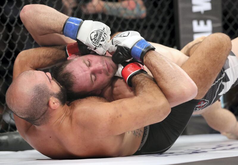 Abu Dhabi, United Arab Emirates - November 29th, 2019: Tarek Suleiman (black shorts) fights Steve Kennedy in the middleweight division during the UAE Warriors event. Friday, November 29th, 2019, Mubadala Arena, Abu Dhabi. Chris Whiteoak / The National