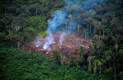 TOPSHOT - General aerial view of illegal deforestation at the Natural National Park in La Macarena, Meta Department, Colombia, on September 3, 2020.  Soldiers carry out the sixth phase of the Artemisa Campaign to combat deforestation in the Amazonian departments of southeastern of the country. / AFP / Raul ARBOLEDA
