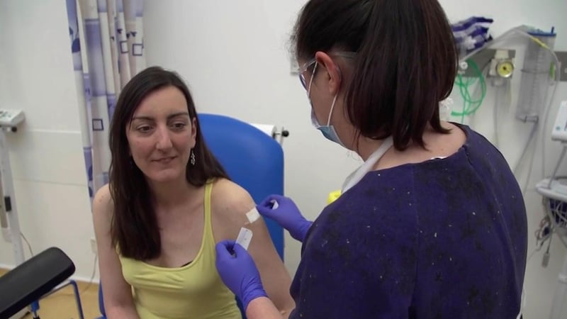 Screen grab taken from video issued by Britain's Oxford University, showing microbiologist Elisa Granato, being injected as part of the first human trials in the UK for a potential coronavirus vaccine, untaken by Oxford University, England, Thursday April 23, 2020.  The first vaccine trial for COVID-19 Coronavirus have begun Thursday. (Oxford University Pool via AP)