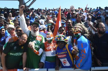 (FILES) In this file photo taken on June 28, 2019 Pakistan (L) and Indian super fans cheer during the 2019 Cricket World Cup group stage match between West Indies and India at Old Trafford in Manchester, northwest England, on June 27, 2019.  - Fierce rivals India and Pakistan will clash on October 24 in Dubai at this year's Twenty20 World Cup, the International Cricket Council said August 17, 2021 as the delayed tournament's fixtures were announced.  (Photo by Dibyangshu Sarkar  /  AFP)  /  RESTRICTED TO EDITORIAL USE