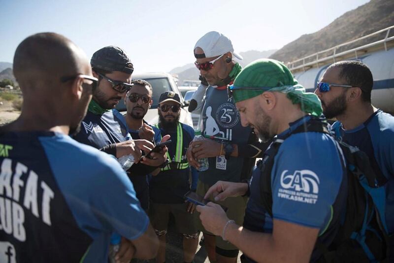 Dr Al Suwaidi stops to take photos with Saudis who cheered him on at the border of Makkah.