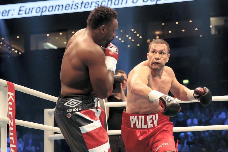 HAMBURG, GERMANY - MAY 07:  Kubrat Pulev of Bulgaria throws a punch at Dereck Chisora of Great Britain during Heavyweight European Championship  between Kubrat Pulev and Dereck Chisora at Barclaycard Arena on May 7, 2016 in Hamburg, Germany.  (Photo by Oliver Hardt/Bongarts/Getty Images)
