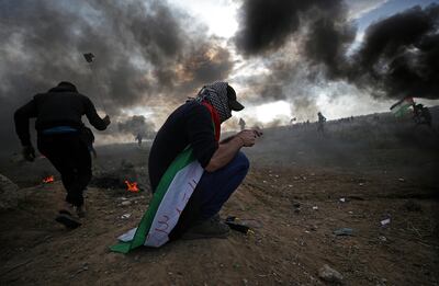 epa06392274 Palestinian protesters throw stones at Israeli troops during clashes near the border with Israel, against US President decision to recognize Jerusalem as the capital of Israel, in the east of Gaza City, 15 December 2017. Two Palestinians were killed during the clashes in the east of Gaza Strip. US president Donald J. Trump on 06 December announced he is recognizing Jerusalem as the Israel capital and will relocate the US embassy from Tel Aviv to Jerusalem.  EPA/MOHAMMED SABER