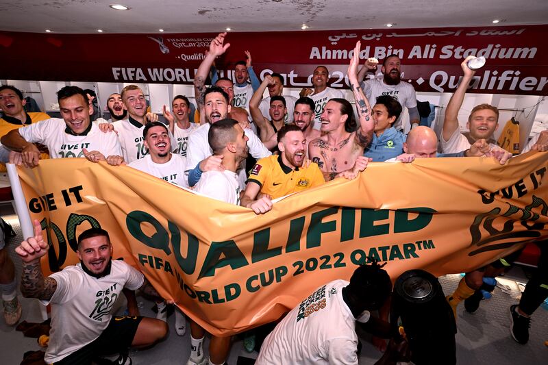 Australia celebrate in their changing room after defeating Peru. Getty Images