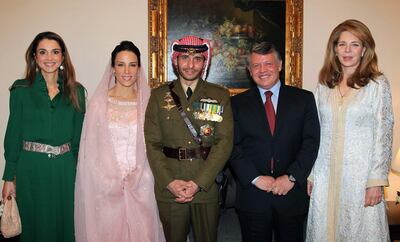 (FILES) In this file handout picture released by the Jordanian news agency Petra on January 12, 2012, shows Jordan's King Abdullah (2nd R), Queen Noor, widow of late King Hussein (R), and Queen Rania (L) posing for a picture with Prince Hamza, half-brother of Jordan's King Abdullah and his new wife Princess Basma Otoum during their  Muslim wedding ceremony at the Royal Palace in Amman . Prince Hamzah bin Hussein, a half-brother of King Abdullah II, has been asked to stop activities that could undermine Jordan's security, the army said April 3, 2021. The Joint Chiefs of Staff head, Major General Yousef Huneiti, also denied media reports that Hamza, a former crown prince, had been arrested.
 / AFP / PETRA / YOUSEF ALLAN
