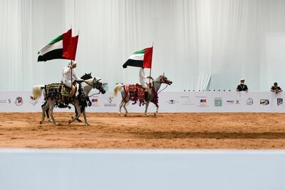 An equestrian performance by Boudheib Academy at this year's event. Khushnum Bhandari / The National
