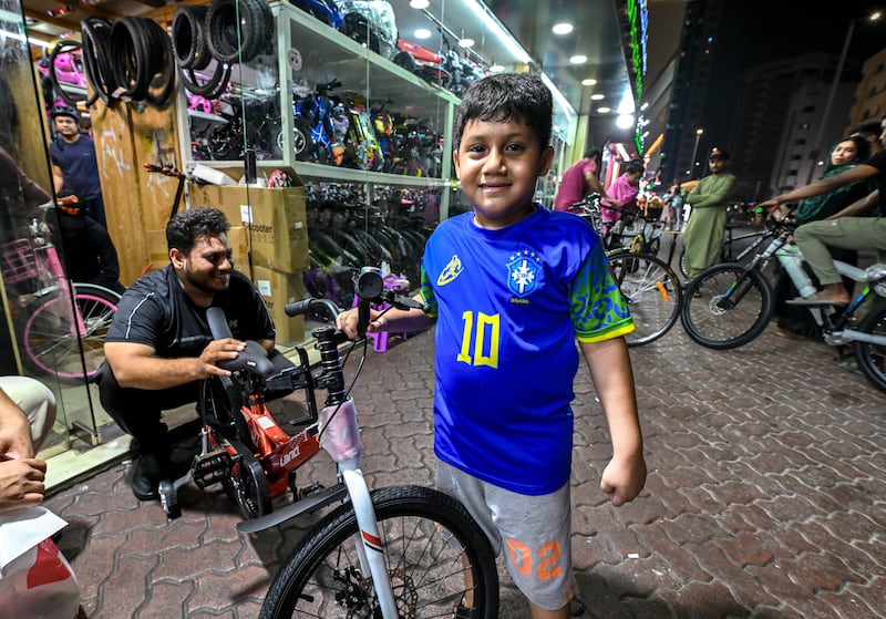 Mohamed Zayn, 6, from India, with his newly assembled bike, is a resident of Al Marafi Street