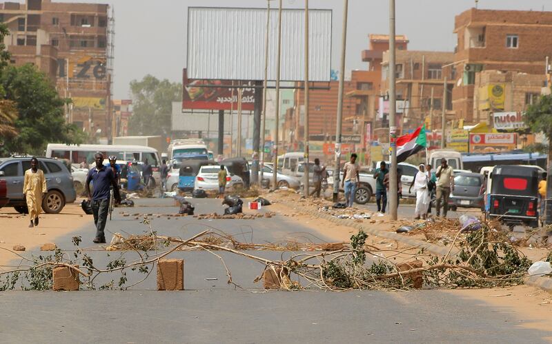 A makeshift barricade is set up as anti-coup protesters take to the streets in Khartoum. AFP