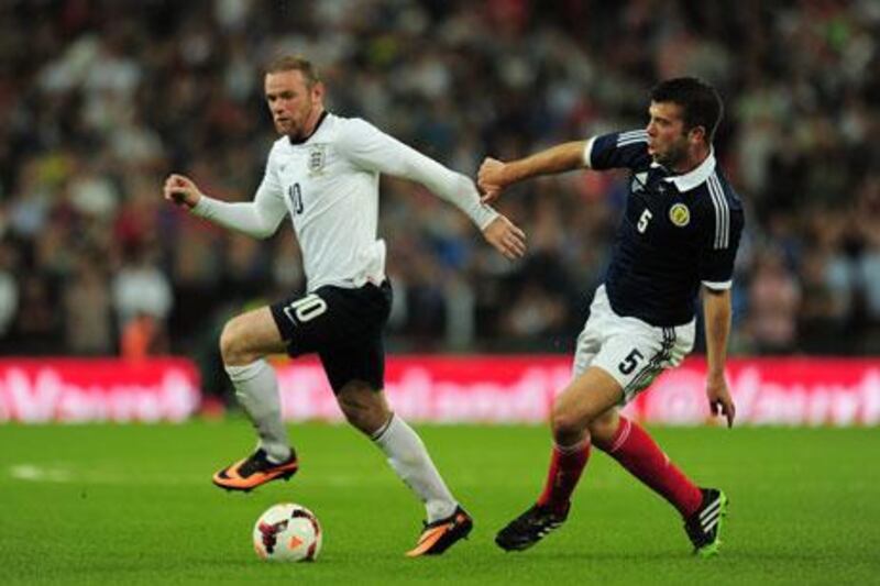 Wayne Rooney, left, played for '67 valuable minutes' in England's international friendly against Scotland. Shaun Botterill / Getty Images