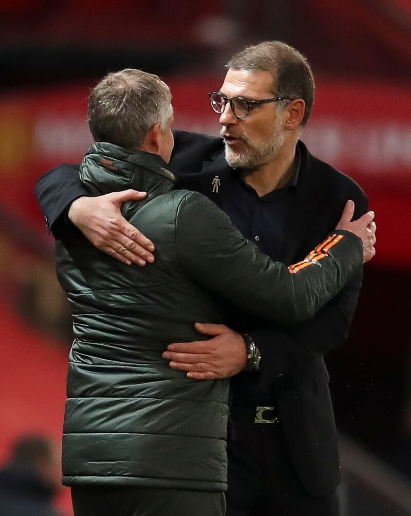 Slaven Bilic of West Bromwich Albion greets Manchester United coach Ole Gunnar Solskjaer. EPA