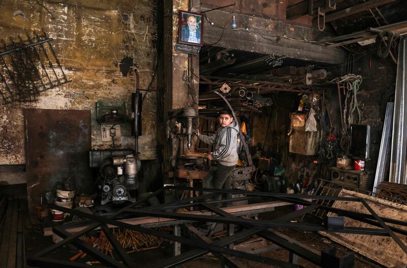 A boy works in a blacksmith's workshop in Bab al-Tabbaneh. A security official estimates that 48 young men have joined ISIS, and that the latest wave of recruits left Lebanon on January 18. Only five of the 48 have so far been accounted for.
