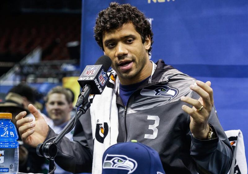 Seattle Seahawks quarterback Russell Wilson was part of the media contingent at last year's Super Bowl. He says that experience has helped him understand the "rhythm" of the event.  JASON SZENES / EPA