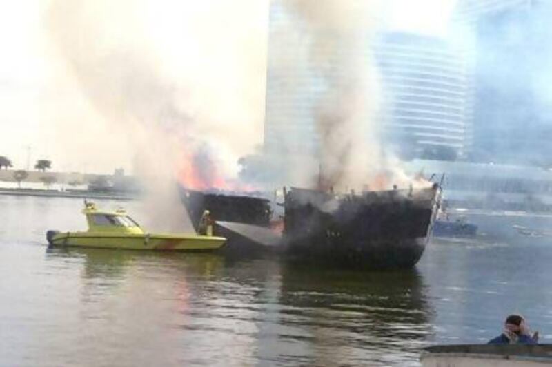 Three boats caught fire in Al Jadaf on Dubai Creek this morning at about 9am. Preeti Kannan / The National