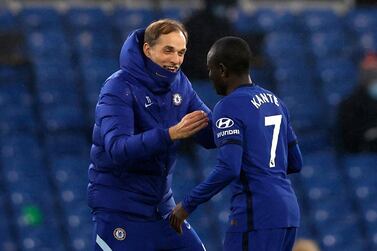 Chelsea manager Thomas Tuchel greets Chelsea's N'Golo Kante after the final whistle during the Premier League match at Stamford Bridge, London. Picture date: Monday February 15, 2021. PA Photo. See PA story SOCCER Chelsea. Photo credit should read: Adrian Dennis/PA Wire. RESTRICTIONS: EDITORIAL USE ONLY No use with unauthorised audio, video, data, fixture lists, club/league logos or "live" services. Online in-match use limited to 120 images, no video emulation. No use in betting, games or single club/league/player publications.