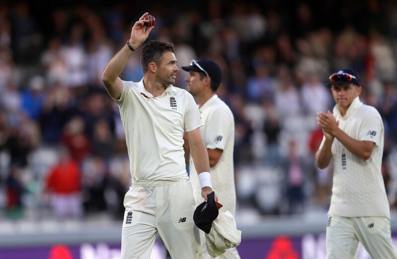 England's James Anderson holds up the ball to applause as he leaves the pitch after India are bowled out for 107 during the second day of the second test match between England and India at Lord's cricket ground in London, Friday, Aug. 10, 2018. (AP Photo/Kirsty Wigglesworth)