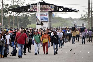 Venezuelans walk crossing the border from Venezuela to Colombia on June 8, 2019 in Paraguachon, Colombia. Getty Images