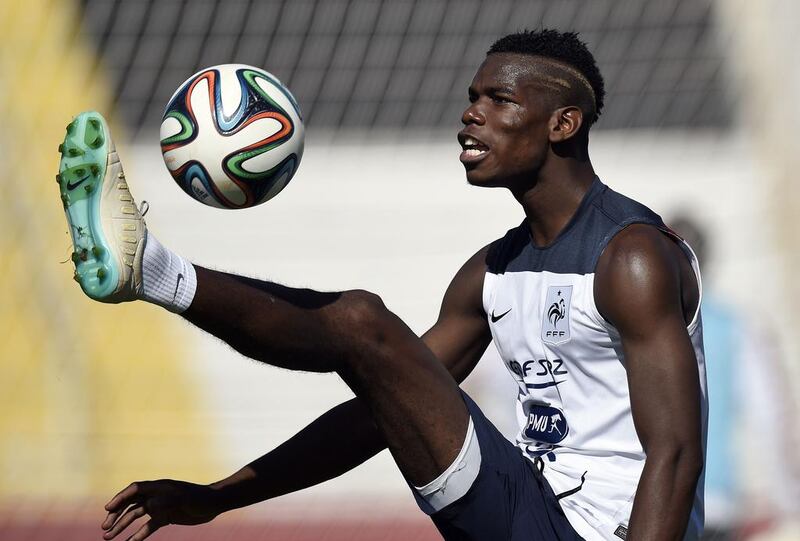 France’s midfielder Paul Pogba controls the ball during a training at the Stadium Santa Cruz in Ribeirao Preto on June 27, 2014.  Franck Fife / AFP 