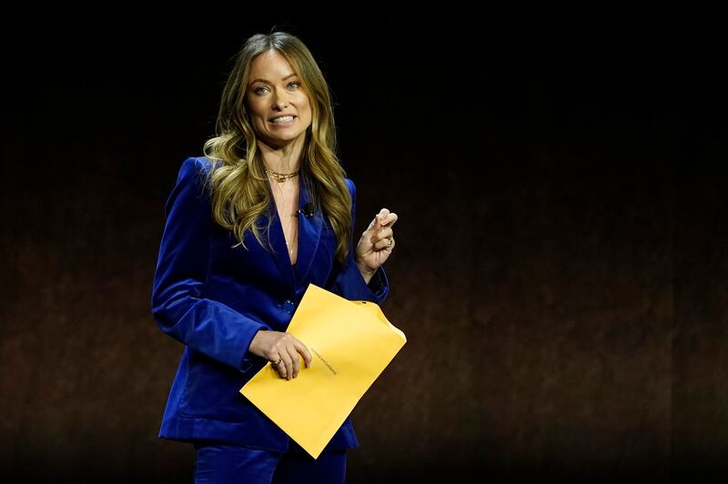 Olivia Wilde, director of the coming film 'Don't Worry Darling', with the envelope that she thought contained a script. AP