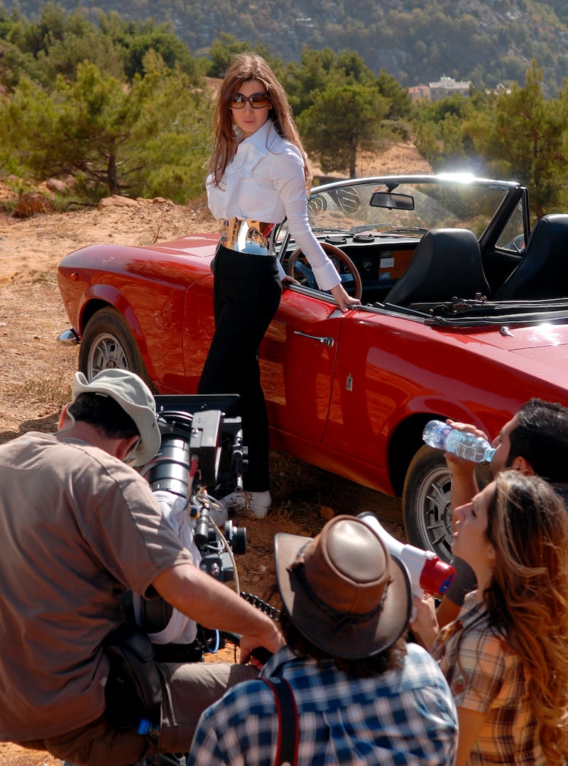 Classic white shirt with jeans and a statement metallic belt on the set of the 'Moshta'aa Leek' video in Beirut, Lebanon on November 6, 2007. EPA