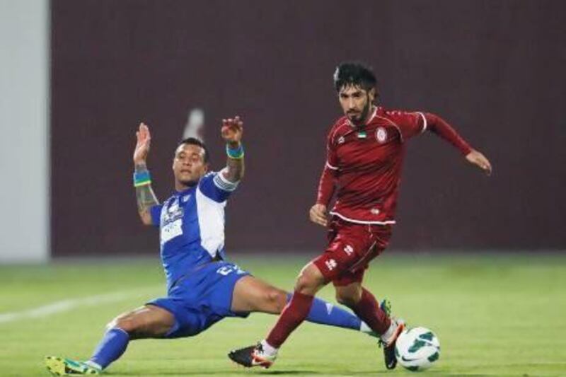 A 53rd-minute strike by Leonardo Lima, left, was not good enough for Al Nasr as Al Wahda came from behind to win tonight. Mike Young / The National