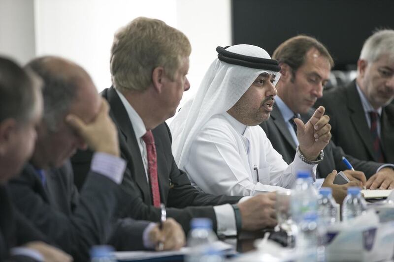 Dr Mohammed Al Mualla, senior vice president of research and development, Khalifa University, centre, and Dr Tod Laursen, university president, third from left, host the UAE-UK industry event. Mona Al Marzooqi / The National