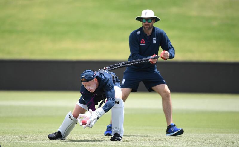 England wicketkeeper Ollie Pope with coach Phil Scott. Getty