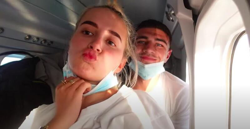 Molly-Mae Hague and Tommy Fury pulled their masks down while on a seaplane in the Maldives. YouTube / Molly-Mae Hague