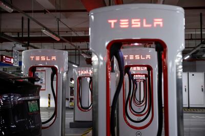 FILE PHOTO: Tesla charging stations are pictured in a parking lot in Shanghai, China March 13, 2021. Picture taken March 13, 2021. REUTERS/Aly Song/File Photo