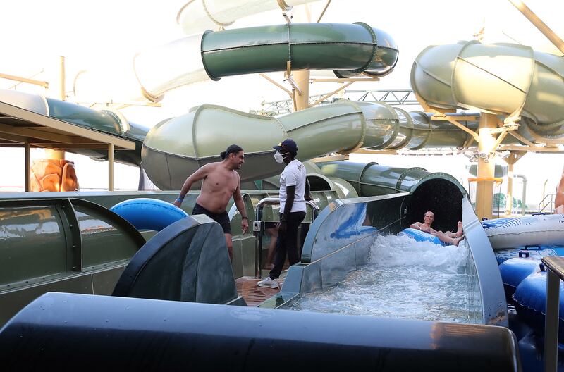 Passengers enjoy the aqua park as the ship is docked in Dubai