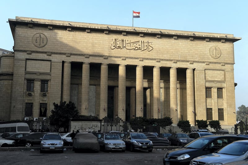 A picture shows Egypt’s High Court in downtown Cairo on January 1, 2015, during the hearing of three Al-Jazeera reporters on charges of aiding the Muslim Brotherhood. Egypt's top court ordered a retrial of the three Al-Jazeera reporters whose imprisonment on charges of aiding the Muslim Brotherhood triggered global outrage, but kept them in custody pending a new hearing. Australian Peter Greste, Egyptian-Canadian Mohamed Fahmy and Egyptian Baher Mohamed of the broadcaster's English service were detained in December 2013. AFP PHOTO / KHALED DESOUKI (Photo by KHALED DESOUKI / AFP)