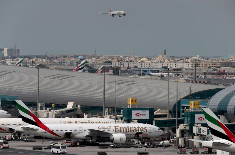 FILE PHOTO: An Emirates Airline plane lands at the Dubai International Airport in Dubai, United Arab Emirates February 15, 2019. REUTERS/Christopher Pike/File Photo