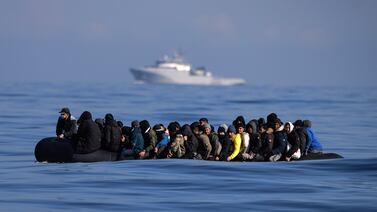 An inflatable dinghy carrying dozens of asylum seekers crosses the English Channel last month. Getty Images
