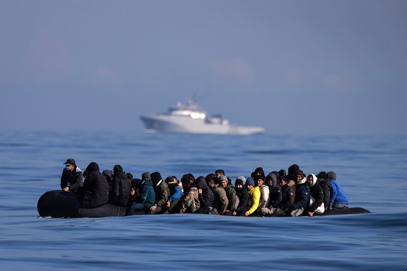 An inflatable dinghy carrying about 65 migrants attempts to cross the English Channel. Getty Images