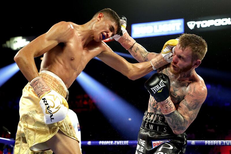 Sebastian Fundora (L) and Daniel Lewis exchange punches during their junior middleweight bout  at MGM Grand Garden Arena in Las Vegas.  AFP