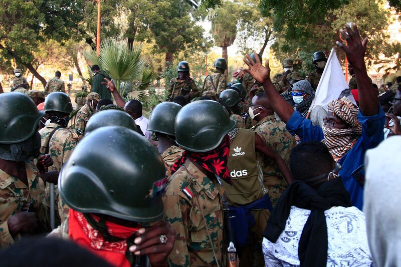 Members of the security forces block protesters from marching into an area of the capital.  AFP