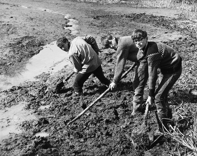 Gordonstoun pupils, from left, Delano Reiss, James Whiteford and Iain Barrett, during restoration work at Michelham Priory near Hailsham, Sussex, in April 1967. The boys are volunteer members of the Conservation Corps of the Council For Nature  