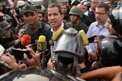 Venezuelan opposition leader Juan Guaido, recognised by many members of the international community as the country's rightful interim ruler, outside La Carlota air force base. Getty Images