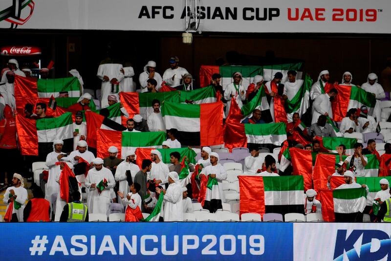 UAE supporters wait for the start of the 2019 AFC Asian Cup group A football match between the United Arab Emirates and Thailand at the Hazza bin Zayed Stadium in Al Ain. AFP