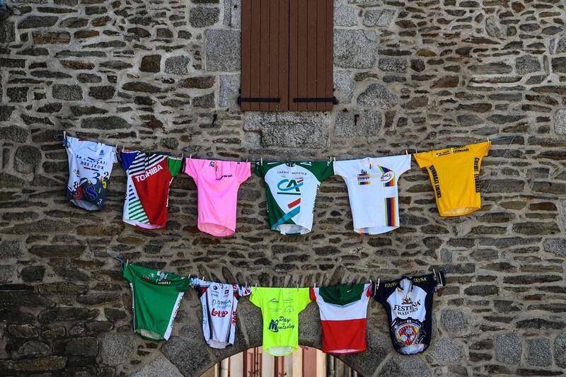 Teams’ jerseys are suspended on a wall during the 190.5 km sixth stage of the 103rd edition of the Tour de France cycling race between Arpajon-sur-Cere and Montauban. Lionel Bonaventure / AFP