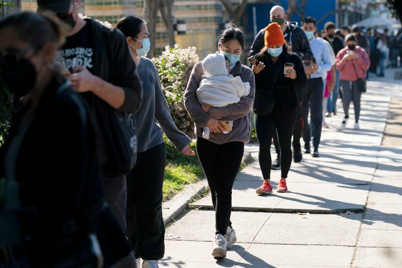 People wait in line for a Covid-19 test in Los Angeles. AP