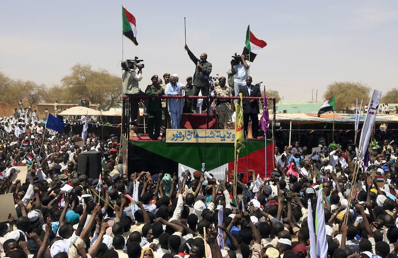 Then Sudanese president Omar Al Bashir addresses supporters during a visit to the North Darfur state capital of Al Fashir. Al Bashir, whose 29-year rule ended in April 2019, was indicted a decade ago by the International Criminal Court for crimes against humanity and genocide in Darfur.  AFP
