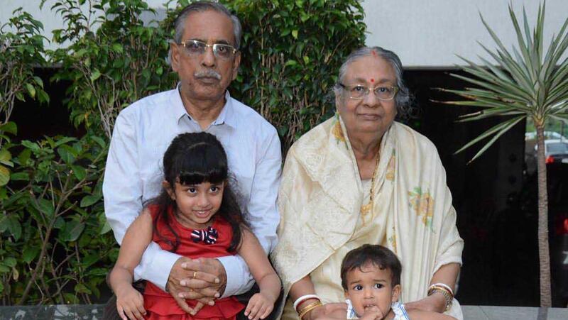 Amal Kumar Mandal and his wife Tripti, pictured with their grandchildren Anahita and Ayantika, have renewed hope of returning to their home in Vadodara, India. Courtesy: Amal Kumar Mandal  