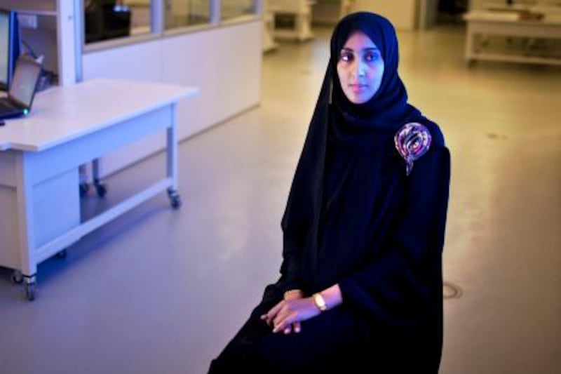 Emirati Wafa Faisa al Yamani, 24, a Water and Environment Engineering graduate student and one in Masdar's first graduating class,  poses for a portrait on Tuesday, May 31, 2011, at one of the labs at the Masdar Institute of Science and Technology near Abu Dhabi. (Silvia Razgova / The National)



