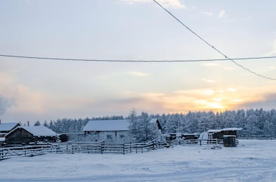2CAC6FY Winter sunset in one of the coldest places on earth, in the village Oymchkon in the Russian North. Alamy
